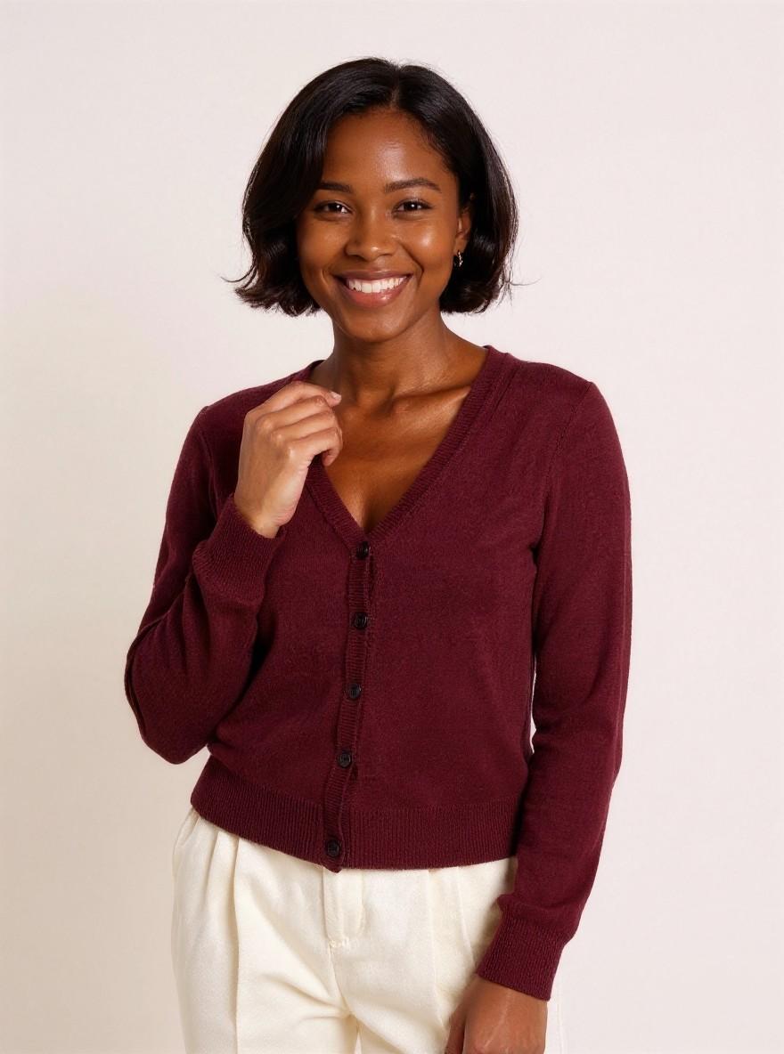 The Fine-Knit Cardigan in Burgundy, front view, close-up of the button placket and V-neck